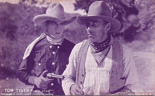 Tom Tyler shines a gun on a tough hombre The Wyoming Wildcat