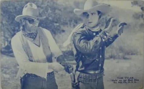 Tom Tyler held up by bad man FBO blue arcade card
